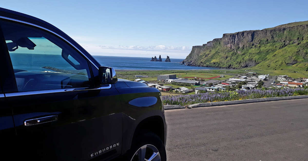 Black Suburban in Vík í Mýrdal view of Reynisdrangar